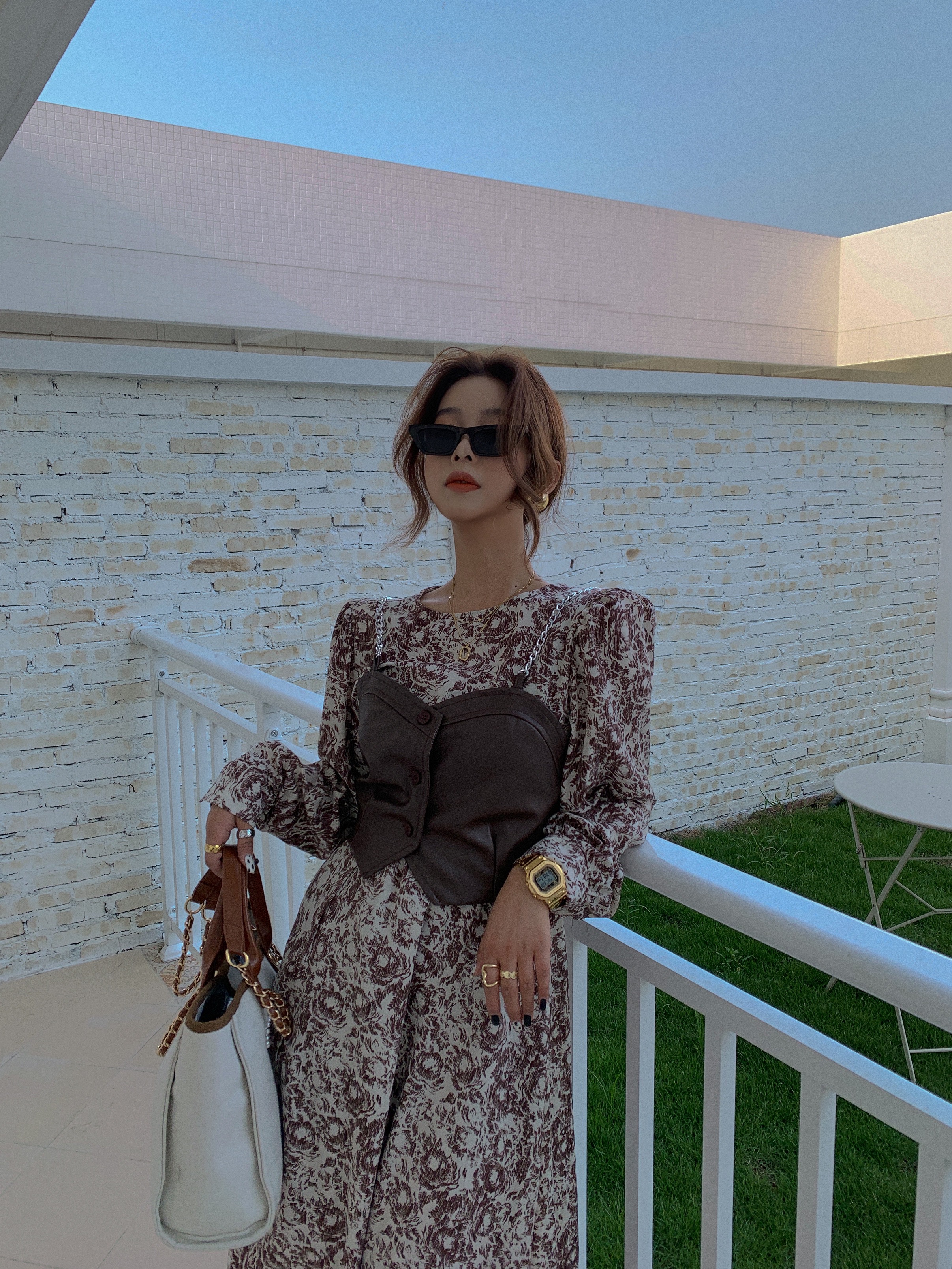 Real shot of South Korea East Gate Design Leather Sling and floral dress