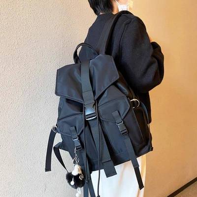 香港双肩包女2025新款时尚尼龙布抽带旅行背包大容量休闲男士书包