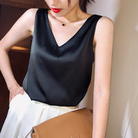 A plus-size, chubby girl wears a women's satin suit with a halter top. The loose base layer makes her look slimmer and covers her belly. She wears a sleeveless top on the outside thumbnail 2