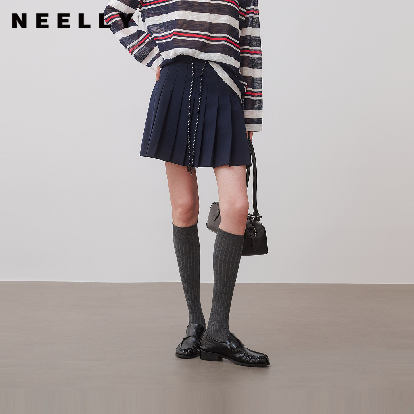 NEELLY纳俪商场同款秋新款设计感拼接百褶裙女休闲百搭趣味A字裙