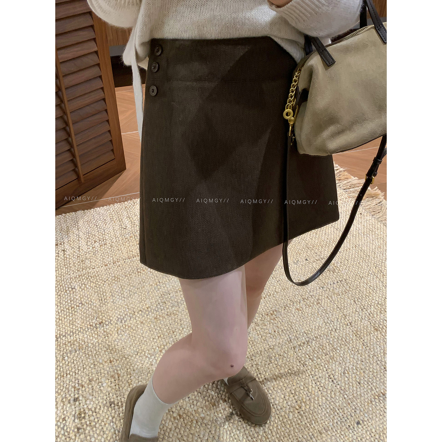 爱情魔鬼鱼 咖色简约高腰半身裙女2026秋季新款气质显瘦A字裙短裙