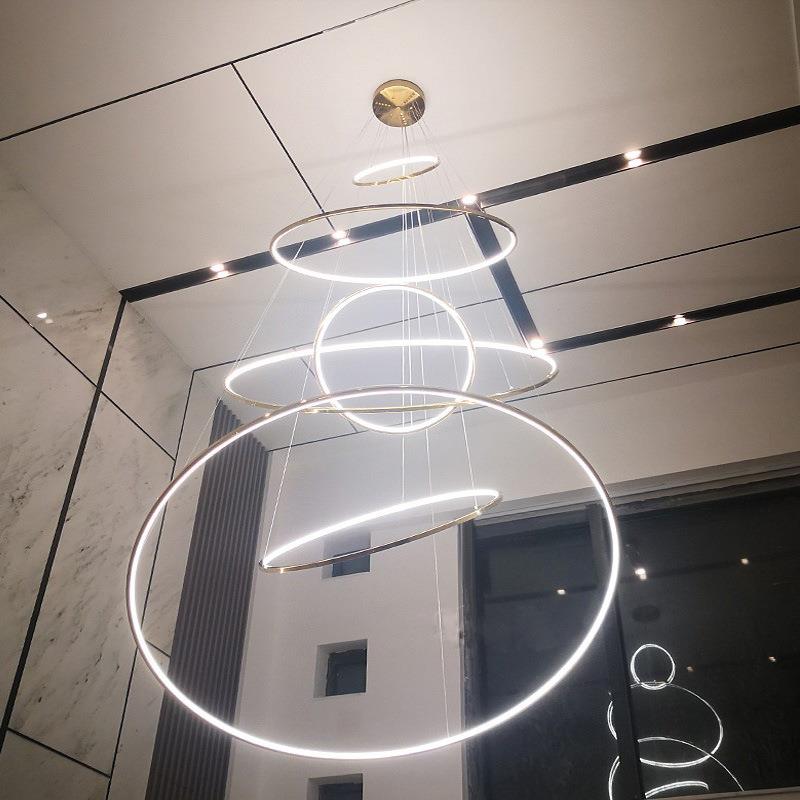 现代简约客厅中空大吊灯复式楼酒店轻奢灯具圆环不锈钢别墅楼梯灯