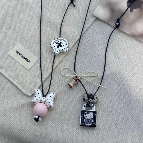 甜美可爱圆珠蝴蝶结猫咪锁头项链时尚ins风高级童趣抽拉毛衣链女