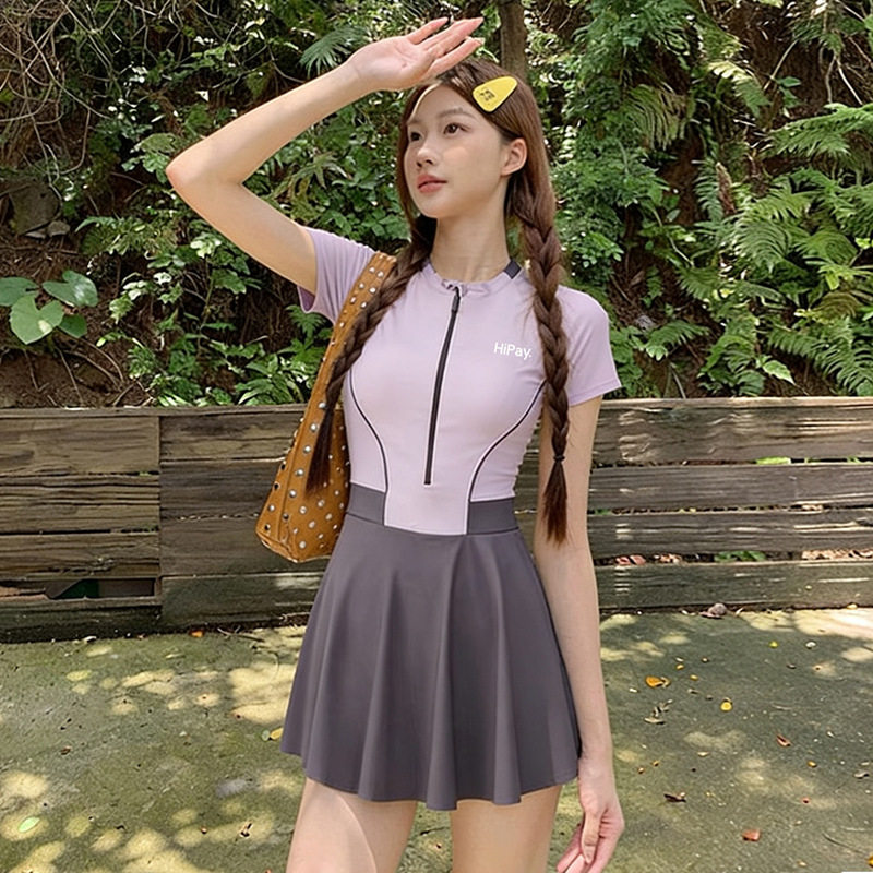 韩版裙式连体衣女生款显瘦遮肚保守2026新款小胸聚拢度假海边泳装