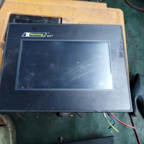 可维修一个南兴封边机触摸屏DOP-B07S411Z0，实物图，议价