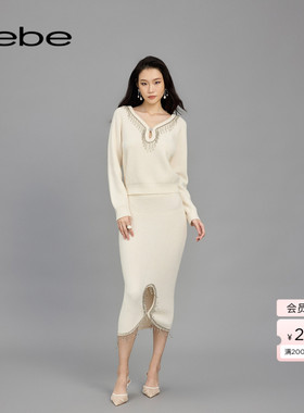 bebe春夏女士绵羊毛流苏仿钻链水滴洞针织半身裙130801