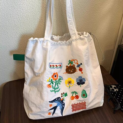 小清新绝美植物刺绣抽绳托特包2026新款大容量通勤购物布袋单肩包
