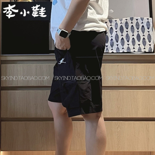 NVE26131 2024SS纯色多口袋梭织锦纶系带中腰运动短裤 New Balance