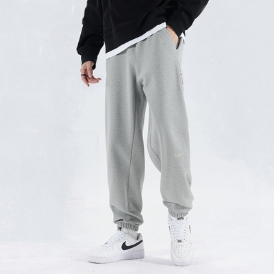 NIKE耐克灰色男裤冬季宽松运动裤卫裤收口束脚针织长裤FZ0225-063