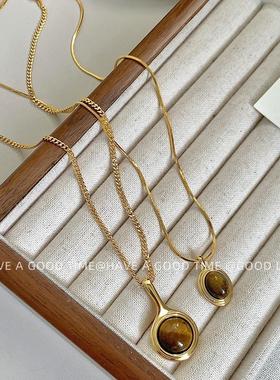 美拉德风椭圆形虎眼石项链简约轻奢琥珀色毛衣链秋冬新款颈链女