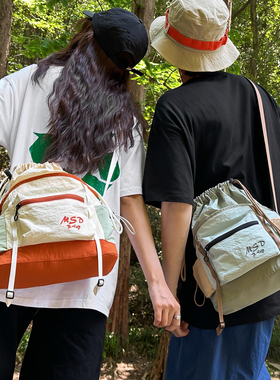 新品森系撞色斜挎包女复古束口抽绳单肩包男生轻便旅行登山小垮包