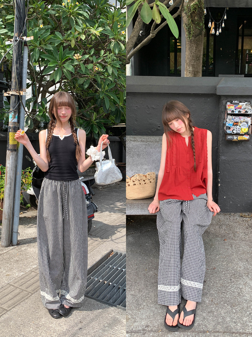 Two women modeling sleeveless tops with black-and-white gingham wide-leg pants outdoors