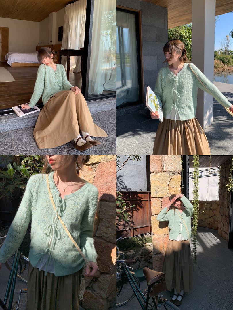 Model wearing a mint green fuzzy tie-front cardigan with a long brown skirt