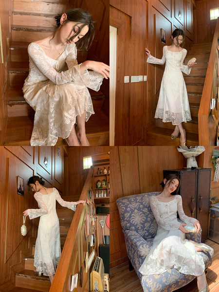 White long-sleeve lace midi dress worn by a model