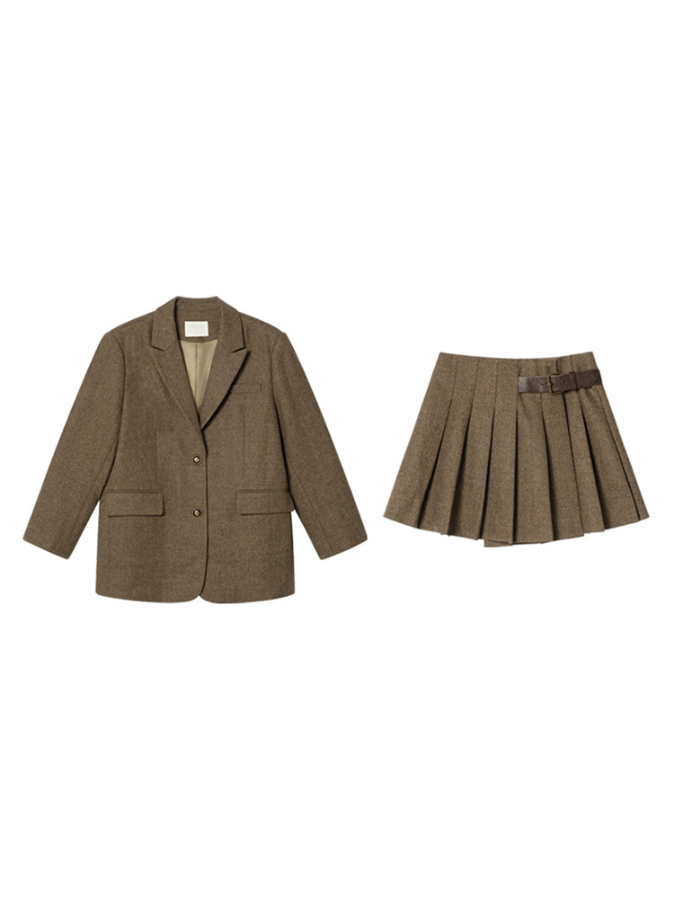 Brown blazer and pleated skirt matching set laid flat on a white background