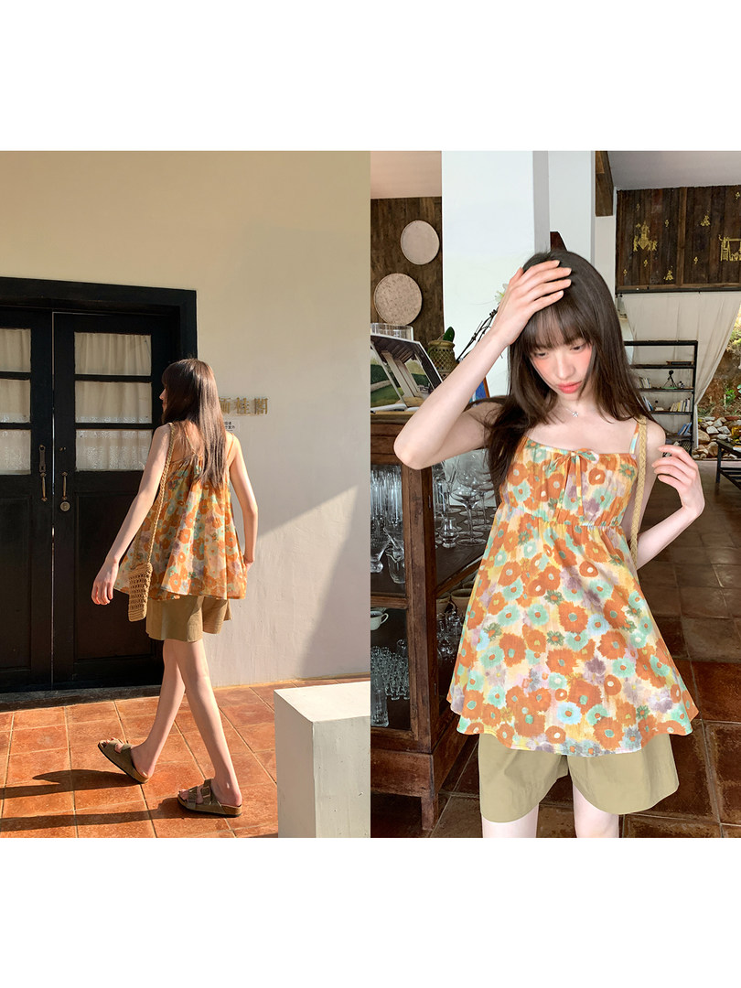 Floral sleeveless summer top worn by a model in a casual outfit