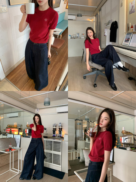 Model wearing a red short-sleeve knit top with dark wide-leg jeans