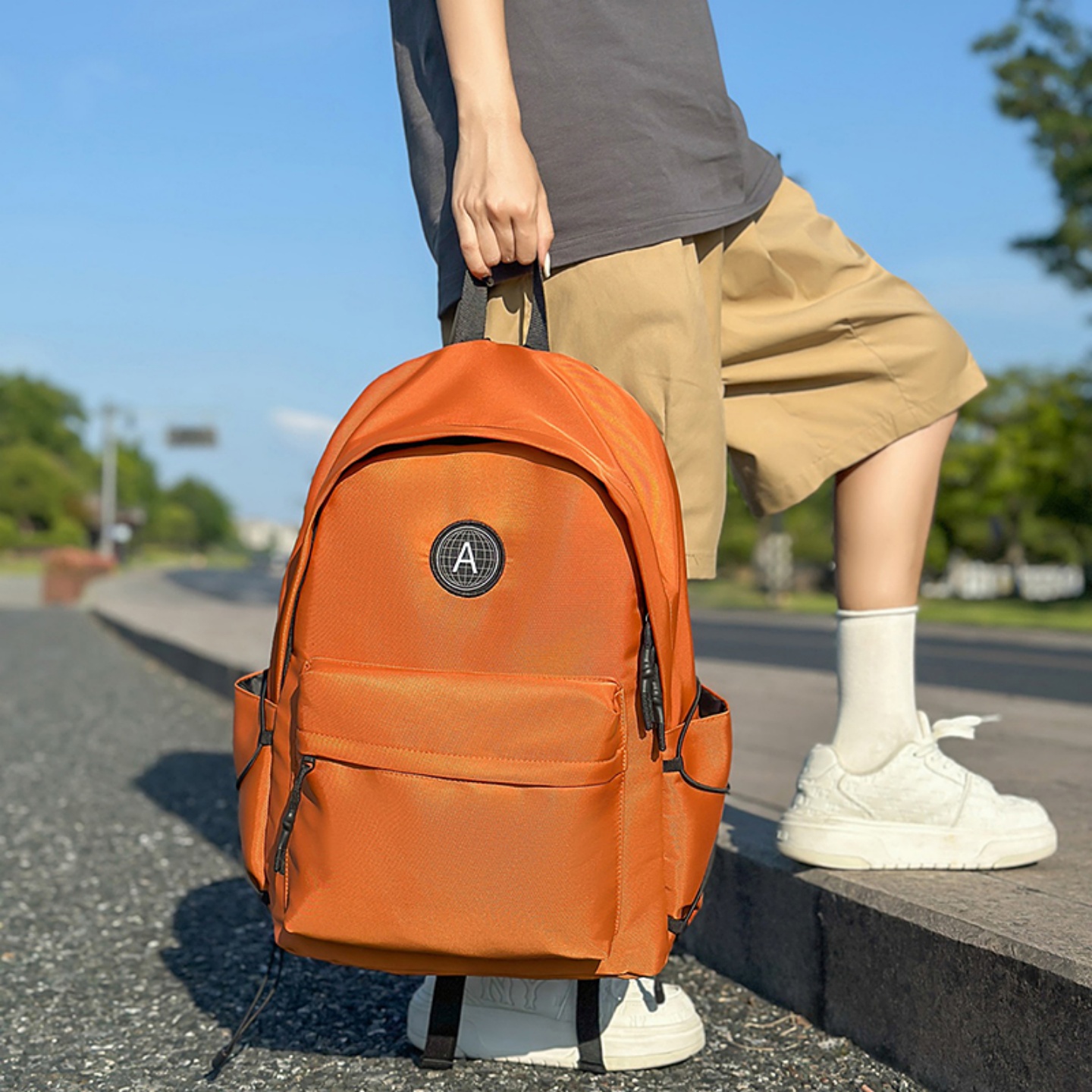 橙色双肩包男女大容量户外旅行背包大学生简约轻便休闲运动包书包