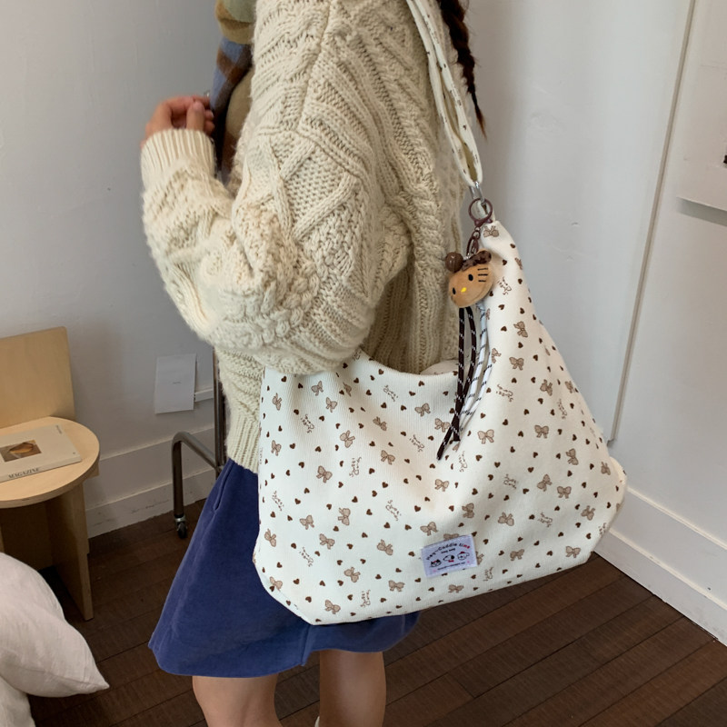 日韩风蝴蝶结印花灯芯绒托特包女2025冬新款大容量帆布单肩斜挎包