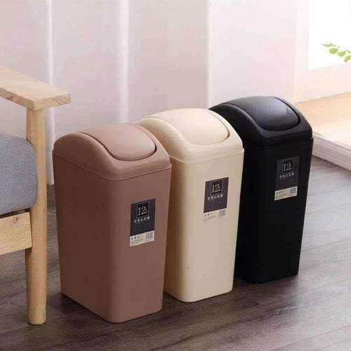 Black dustbin with cover and cover toilet paper to put in