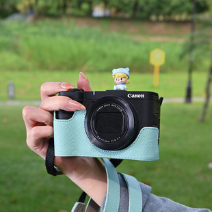 适用佳能V1真皮保护套R50相机包R10底座R100皮套壳配件头层牛皮