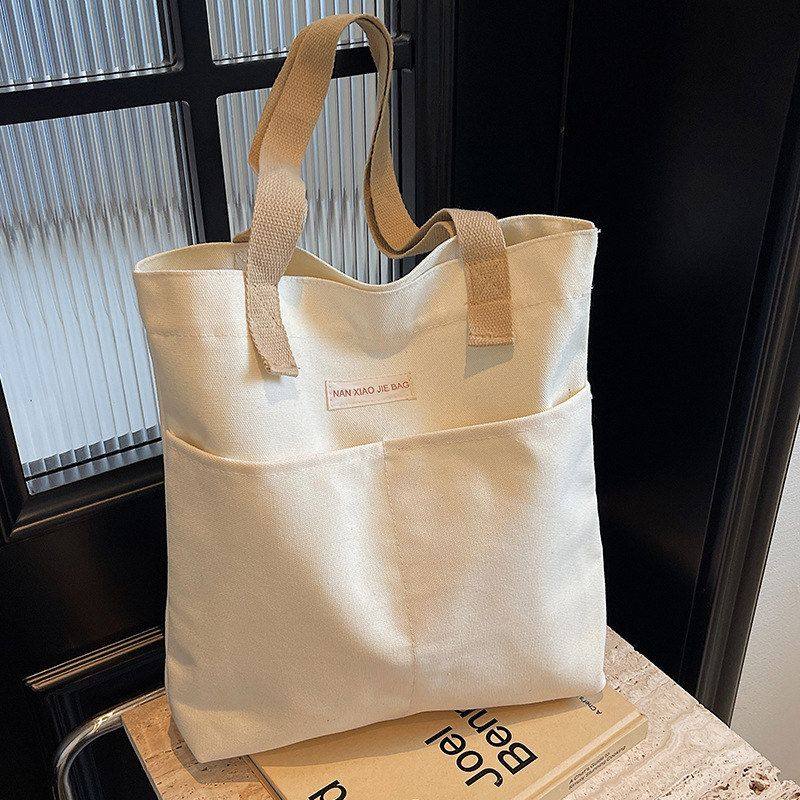 帆布包大容量加厚单肩手提包简约女通勤上班上课装书本a4文件布袋