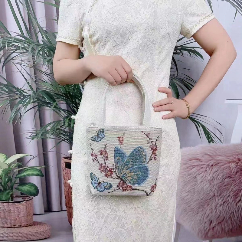 进口双倍开心民族风帆布包手提包手拎外出双面刺绣手机包HK