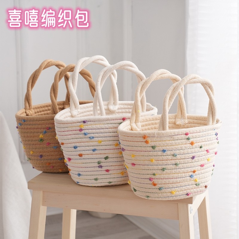 女生可爱手提编织包手提棉绳彩球收纳袋百搭手机水杯包创意伴手礼