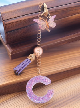 跨境亚马逊热卖英文字母树脂钥匙 紫色蝴蝶流苏挂坠女士包包挂件