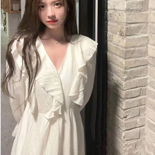 春秋杏色法式桔梗茶歇长袖连衣裙女今年新款别致仙气收腰中长裙子
