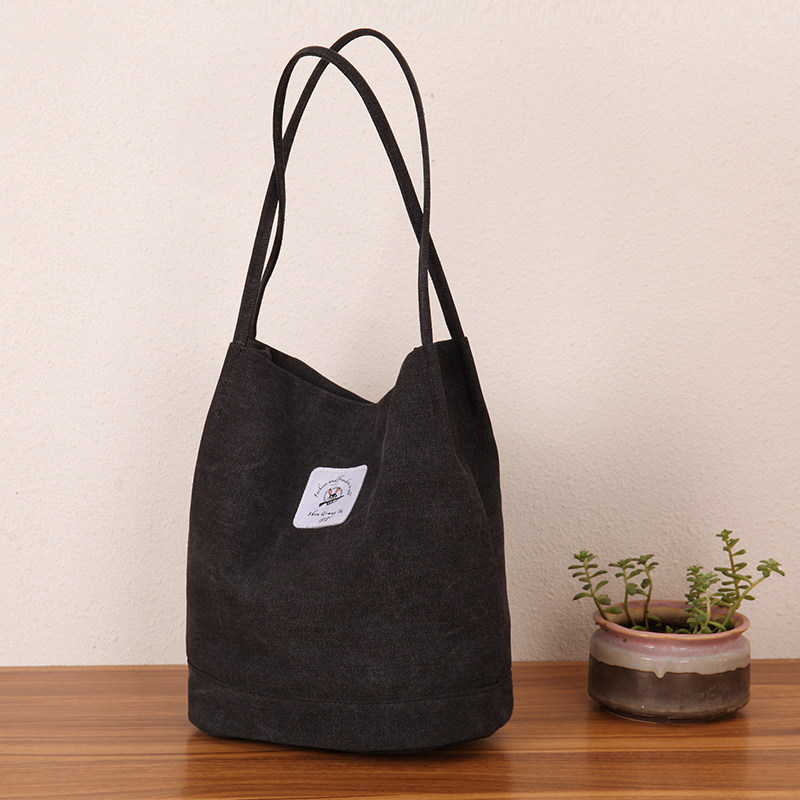 秋冬纯色款帆布包女单肩水桶包文艺复古极简帆布袋女士手提学生包