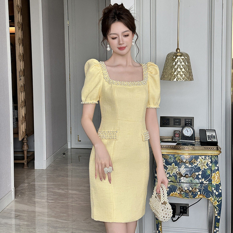 欧洲站茶歇法式夏日绝美小裙子包臀黄色连衣裙2025新款轻奢高级感