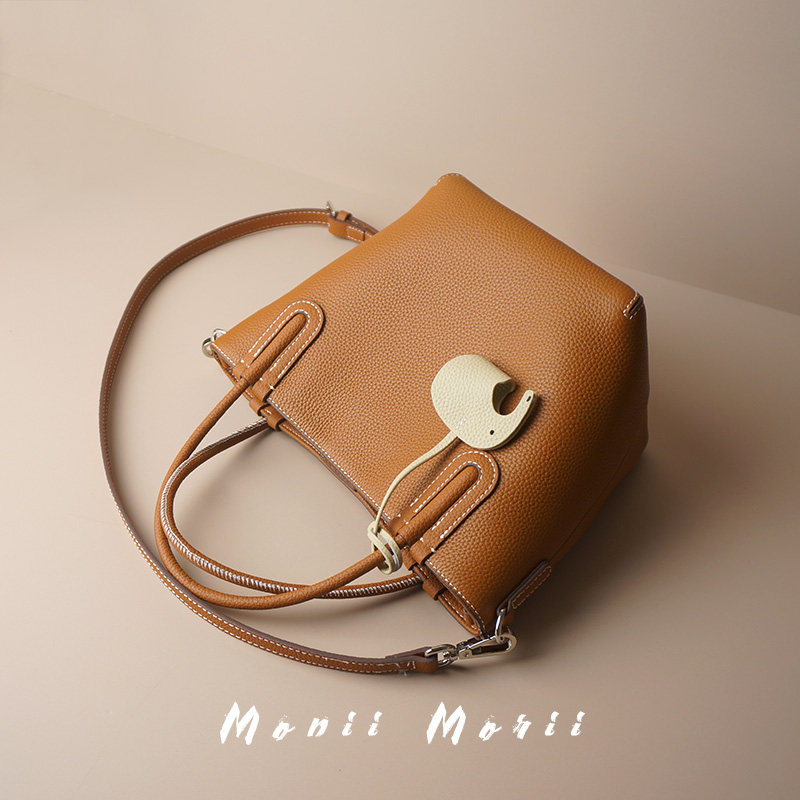 怪兽君2026新款高级感包包趣闻水桶包头层牛皮手提包真皮斜挎包女