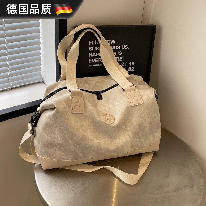 德国大容量手提旅行包女新款外出行李包男出差旅游收纳短途登机包