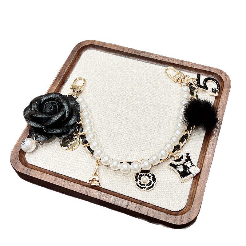 时尚水貂毛皮质山茶花手提包包挂链网红爆款创意精致包包挂饰