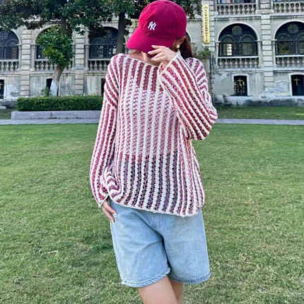 初秋新款中长款长袖毛衣女宽松性感镂空针织衫时尚设计感圆领上衣