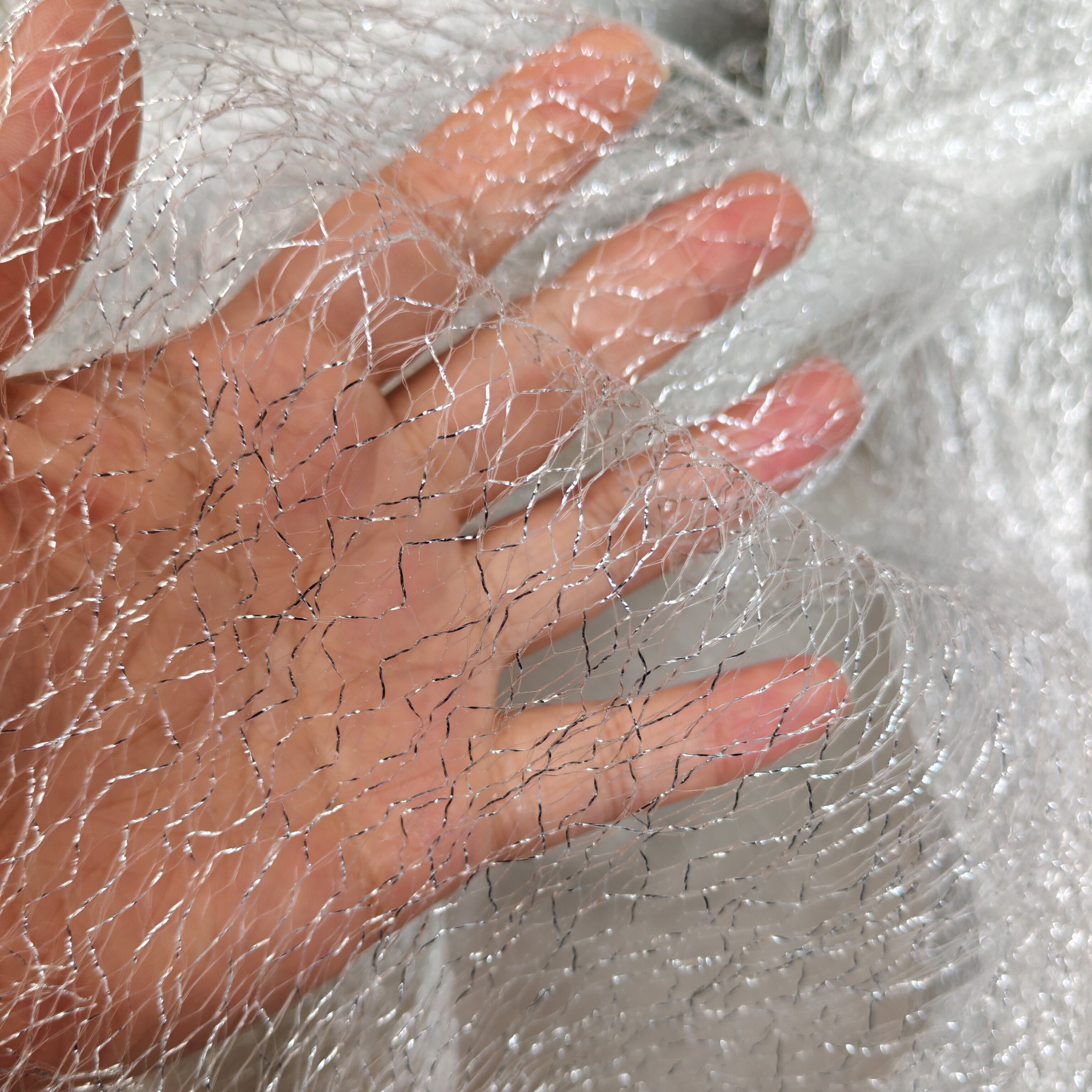 银丝线闪亮光不规则镂空透视面料