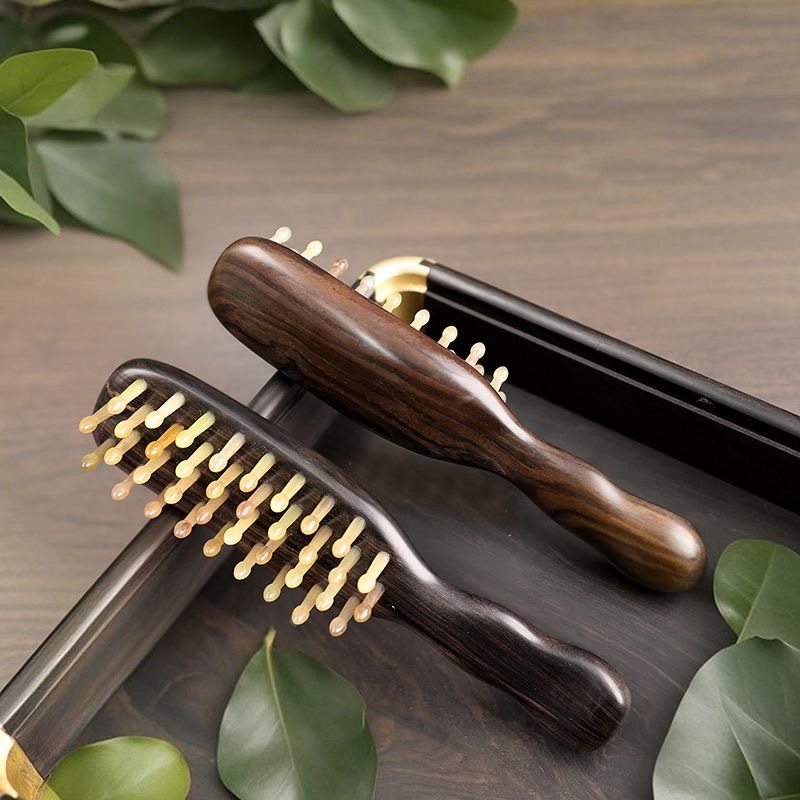 紫光檀羊角长柄按摩梳通络便携