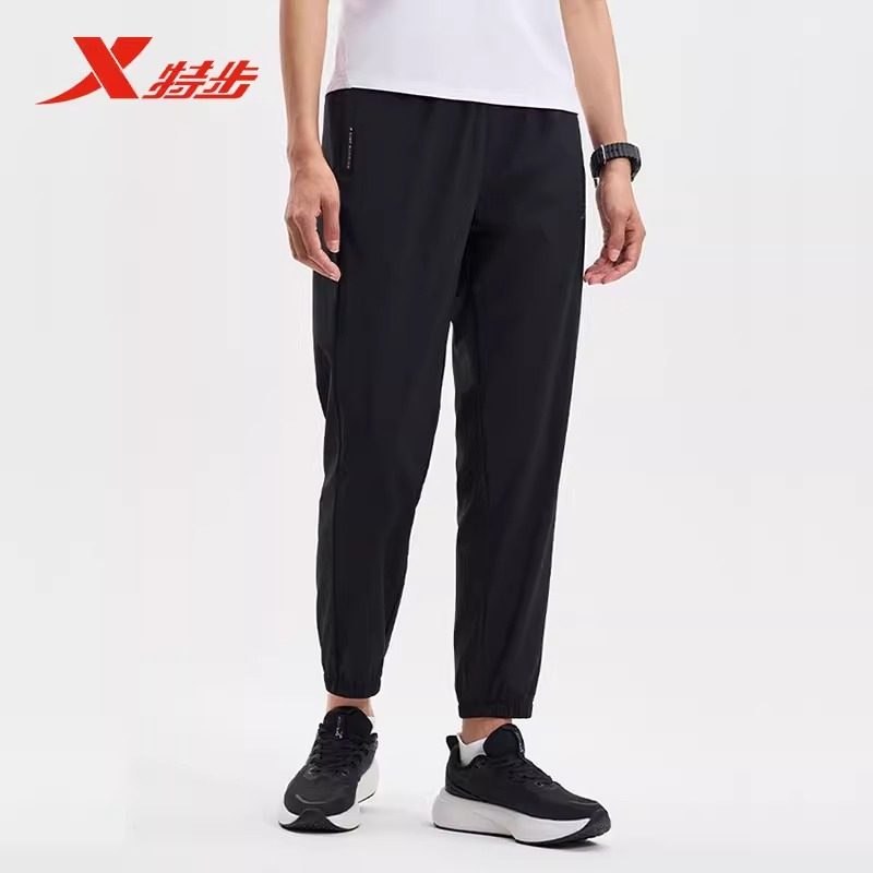 特步梭织九分裤女裤2025夏季冰丝速干运动裤梭织长裤975228690067