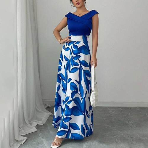 A sleeveless navy blue dress with blue and white leaf print
