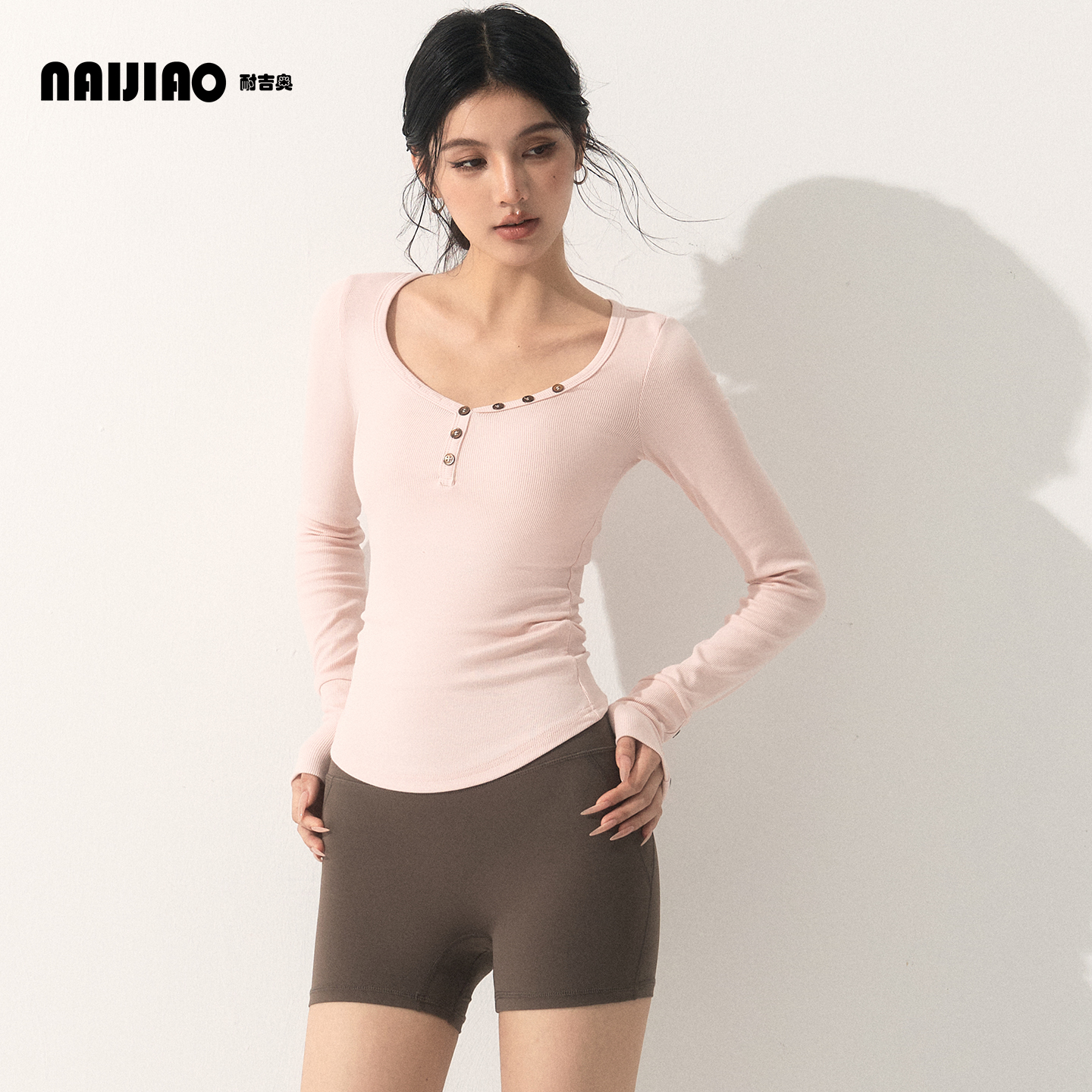 耐吉奥修身V领纽扣长袖瑜伽服