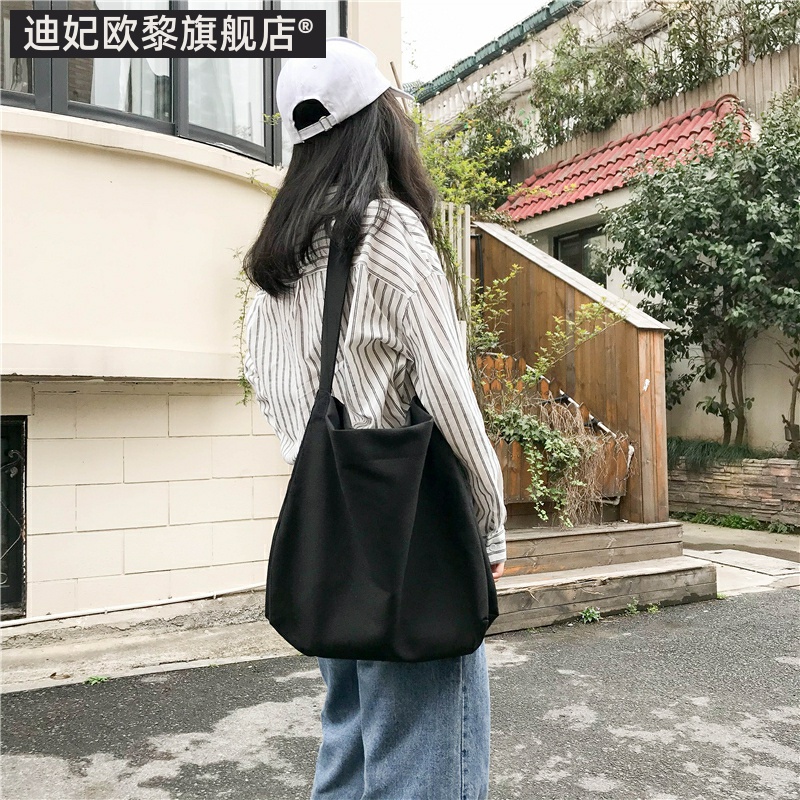 包包女2023新款ins包包女chic帆布斜挎单肩简约大容量学生邮差包