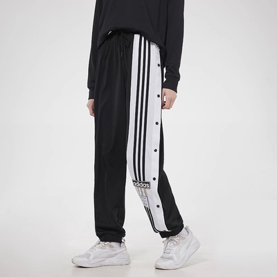 阿迪达斯三叶草女裤侧排扣条纹印花运动裤束脚宽松休闲长裤GJ6580
