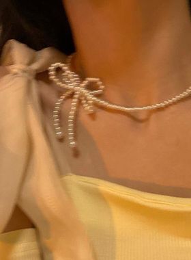 网红仙气编织蝴蝶结珍珠项链女夏轻奢小众设计感锁骨链2021年新款