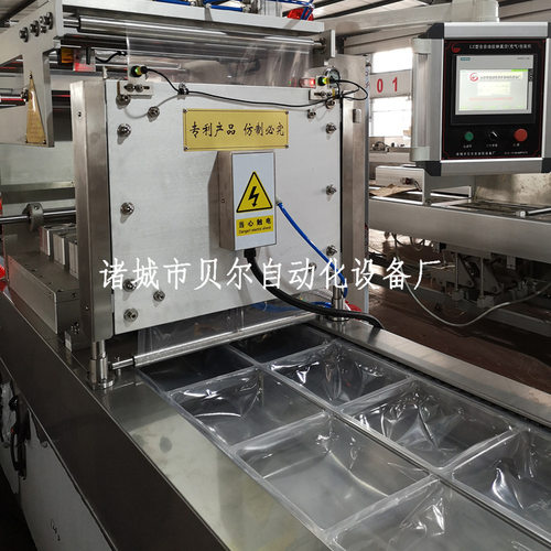全自动拉伸膜包装机，连续热成型包装机，诸城贝尔真空包装机厂家