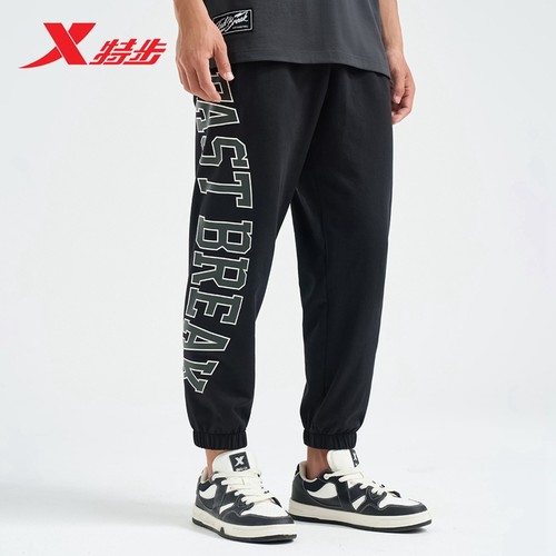 特步运动裤2025秋冬新款黑色宽松透气男子针织九分裤976229840044