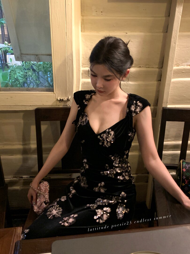 Black floral sequined dress worn by a model