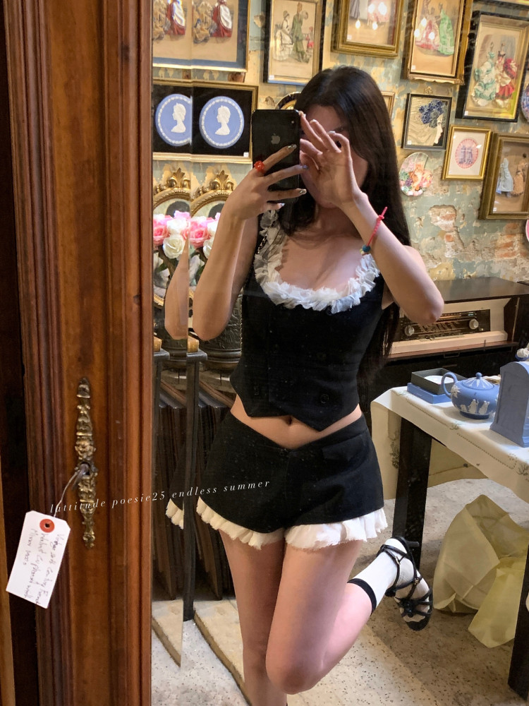 Black and white ruffled two-piece outfit worn in a mirror selfie