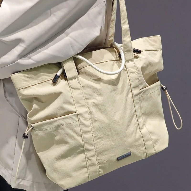 安踏提挎包收纳托特包休闲包男女新款手提拎包单肩包192618142