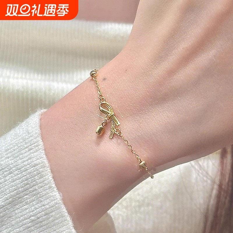 古法金色蝴蝶结流苏金豆手链女时尚轻奢精致简约手饰品